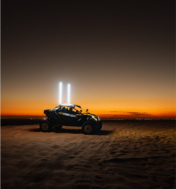Dune buggy at sunset in the desert